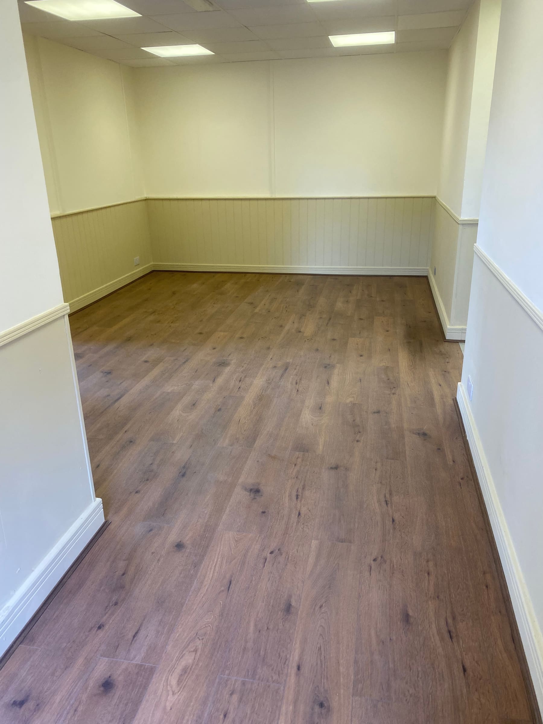 Panelled walls meeting the new flooring